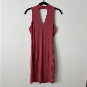 High neck, deep v, bodycon pink minidress.